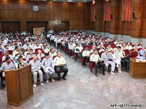 Suspected opposition supporters (in grey) attend their trial in Tehran, Iran, on August 16.