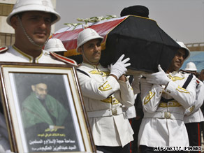 Iraqi honor guards carry the coffin of Shiite leader Abdul Aziz al-Hakim after it arrives Friday in Baghdad.