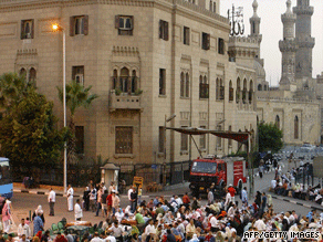 Egyptians gather outside a mosque to break the holy Ramadan fast at sunset and enjoy a large meal.