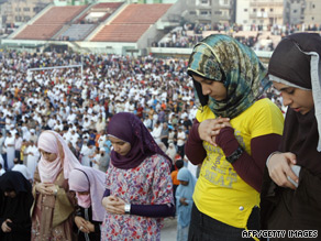 Egyptian women perform the Eid al-Fitr dawn prayer at a stadium in Mansura, 120 km north of Cairo.