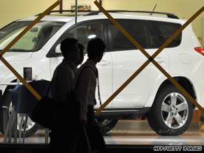 The window of a car showroom in Taipei, Taiwan, is taped in preparation for Typhoon Morakot.