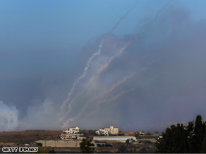 Palestinian Qassam rockets are fired by Hamas militants inside the Gaza Strip towards the Israeli town of Sderot on Tuesday, as seen from Israel's border with the Palestinian territory.
