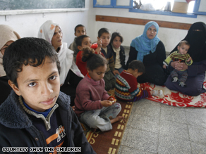 A picture taken Sunday by a Save the Children photographer of a Palestinian family taking refuge in a local school.