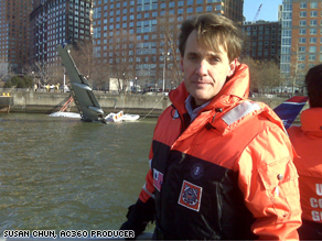 CNN's David Mattingly on a Coast Guard boat by New York's Battery Park in front of the downed plane.