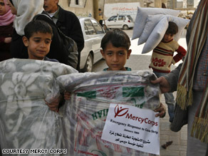 Children in Gaza receive humanitarian aid from a Mercy Corps delivery.
