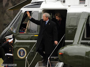 President Bush has commuted two prison sentences on his last full day in office.