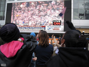 Crowds in Washington watch CNN broadcast the presidential inauguration Tuesday.