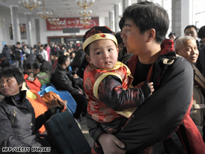 Thousands wait for their train at Beijing Railway Station