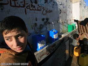 Children in Gaza fill water containers during the cease-fire.