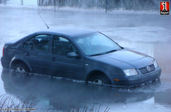 iReporter Francois Chouinard captures cars stuck in ice block after a water pipe break in Montreal, Canada