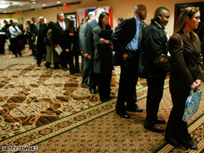 Job seekers stand in line at a job fair in Virginia.