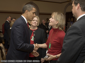 President Barack Obama shakes hands with Beverly Eckert on Feb. 6, 2009, during a  meeting in Washington, D.C., at the Eisenhower Executive Office Building with a group who lost family members in the 9/11 and the U.S.S. Cole tragedies.
