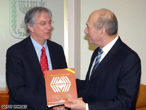 Israeli Prime Minister Ehud Olmert receives the Jewish People Policy Planning Institute's report from Dennis Ross on January 6, 2008 in Jerusalem.