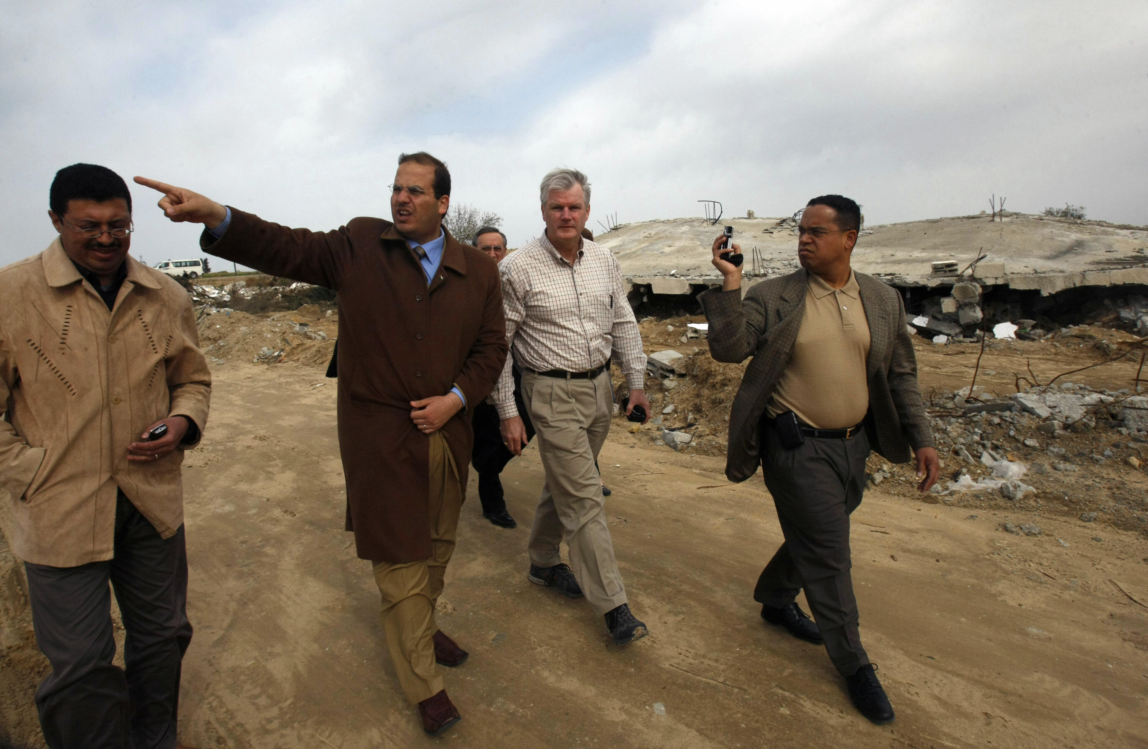 MOHAMMED ABED/AFP/Getty Images. US Democratic Congressmen Keith Ellison (R) and Brian Baird (2nd R) listen to a Palestinian owner of a company that was destroyed during Israel's 22-day offensive during a visit to the Jabalia refugee camp in the northern Gaza Strip.