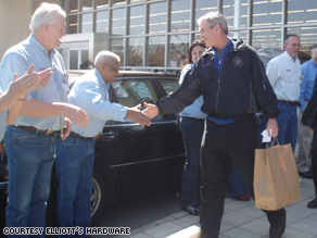 George W. Bush shakes hands with Greeter Henry Long.