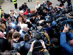The couple's publicist Max Clifford, center, tells waiting media that the couple have married.