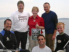 Debbie Fletcher surrounded by Team Attakulla