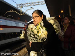 Women pictured with flowers at Atocha station on the fifth anniversary of the Madrid terror attacks.