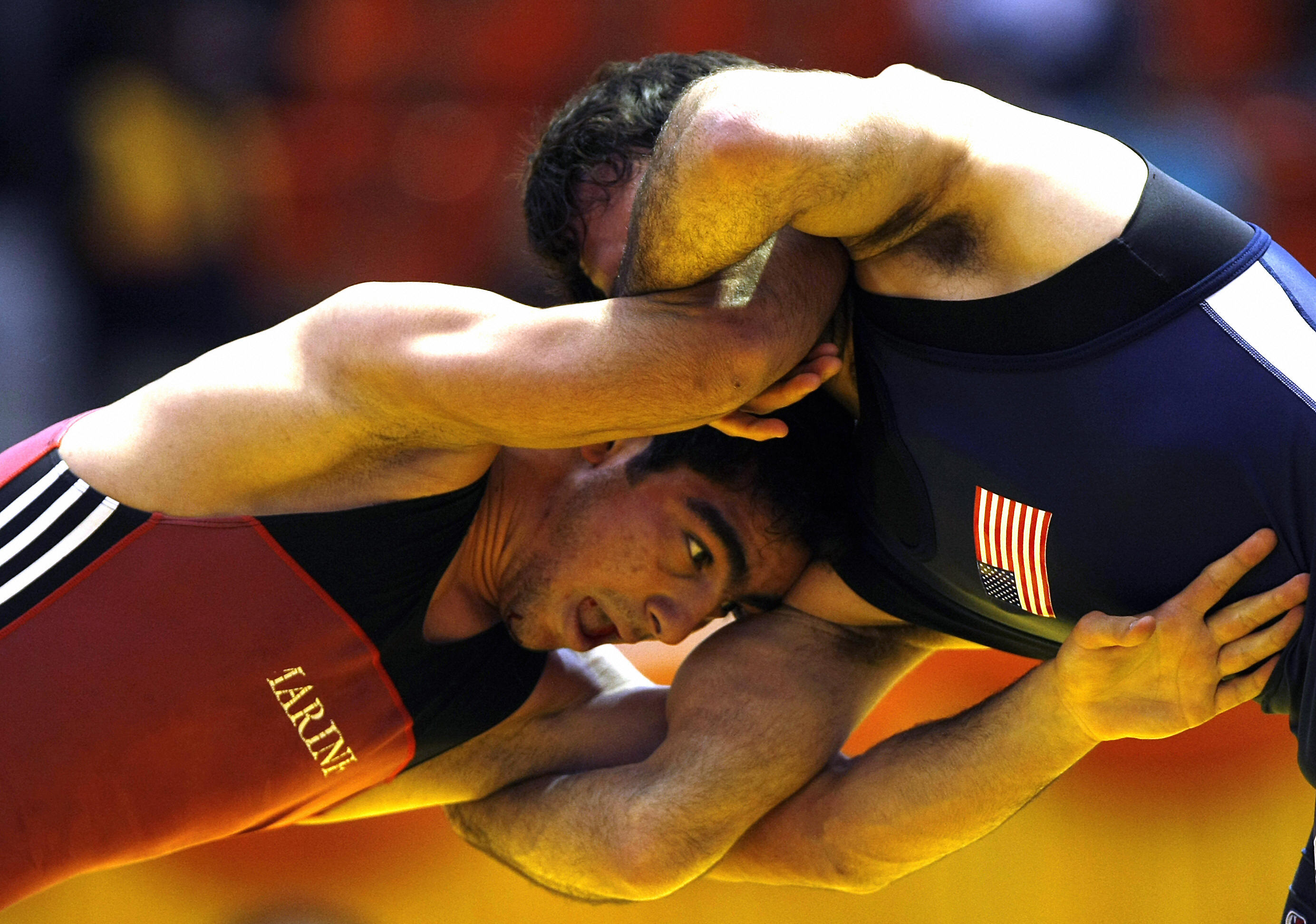 BEHROUZ MEHRI/AFP/Getty Images. Iranian Mostafa Hossein-Khani (L) wrestles with US Michael Zadik (R) in the 66kg freestyle category at the 29th International Takhti Cup wrestling tournament in Tehran on March 12, 2009.