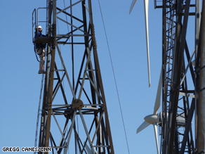 Technicians climb wind turbines in Tehachapi, CA.