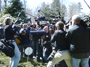 The pack of media at the home of AIG executive Douglas Poling as the group tries to deliver the letter.