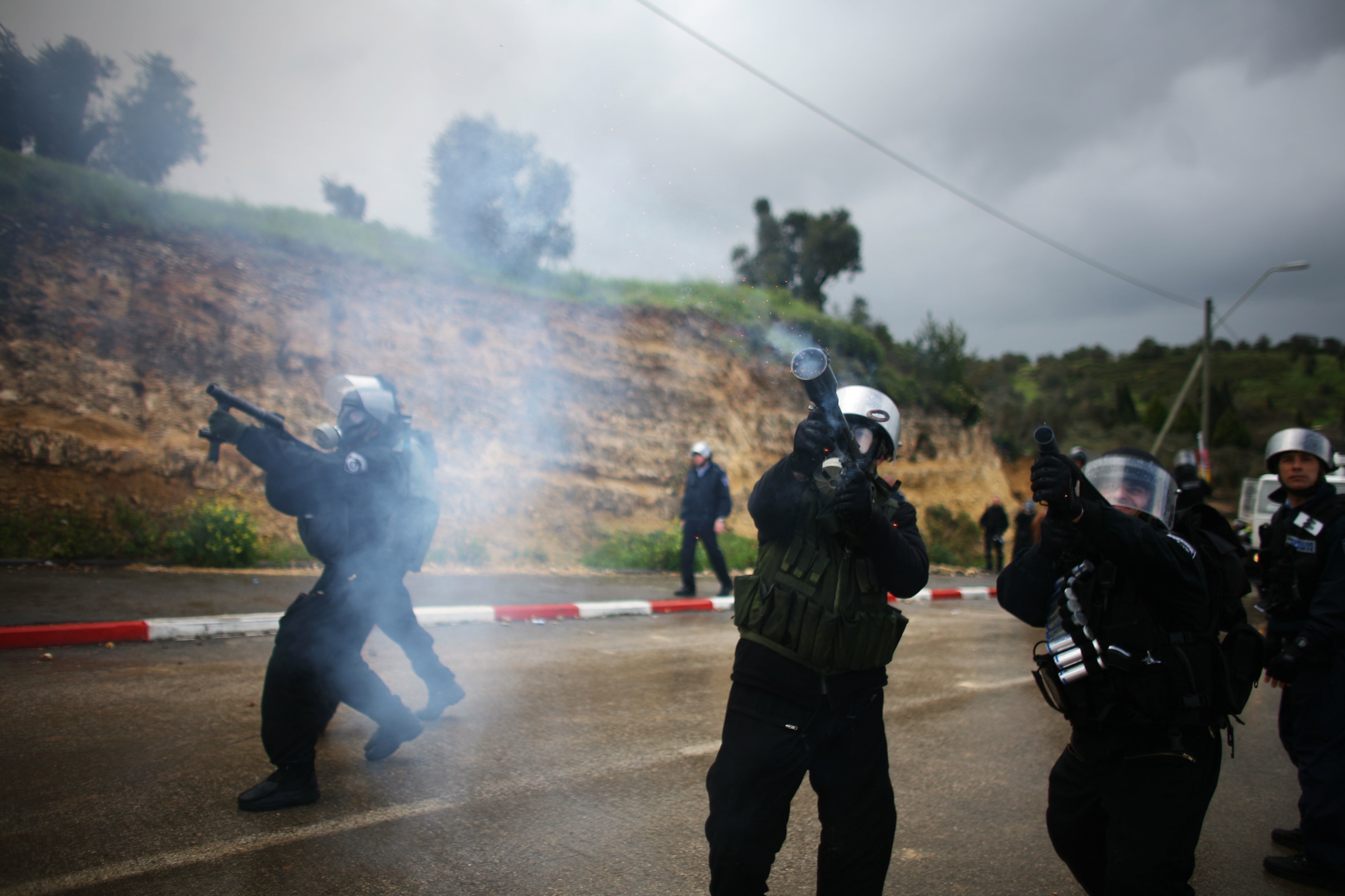 Uriel Sinai/Getty Images. Israeli police shoot tear gas as they clash with local Arabs after a provocative march of flags by right-wing Israelis descended into violence, on March 24, 2009 in Umm al-Fahm in northern Israel.