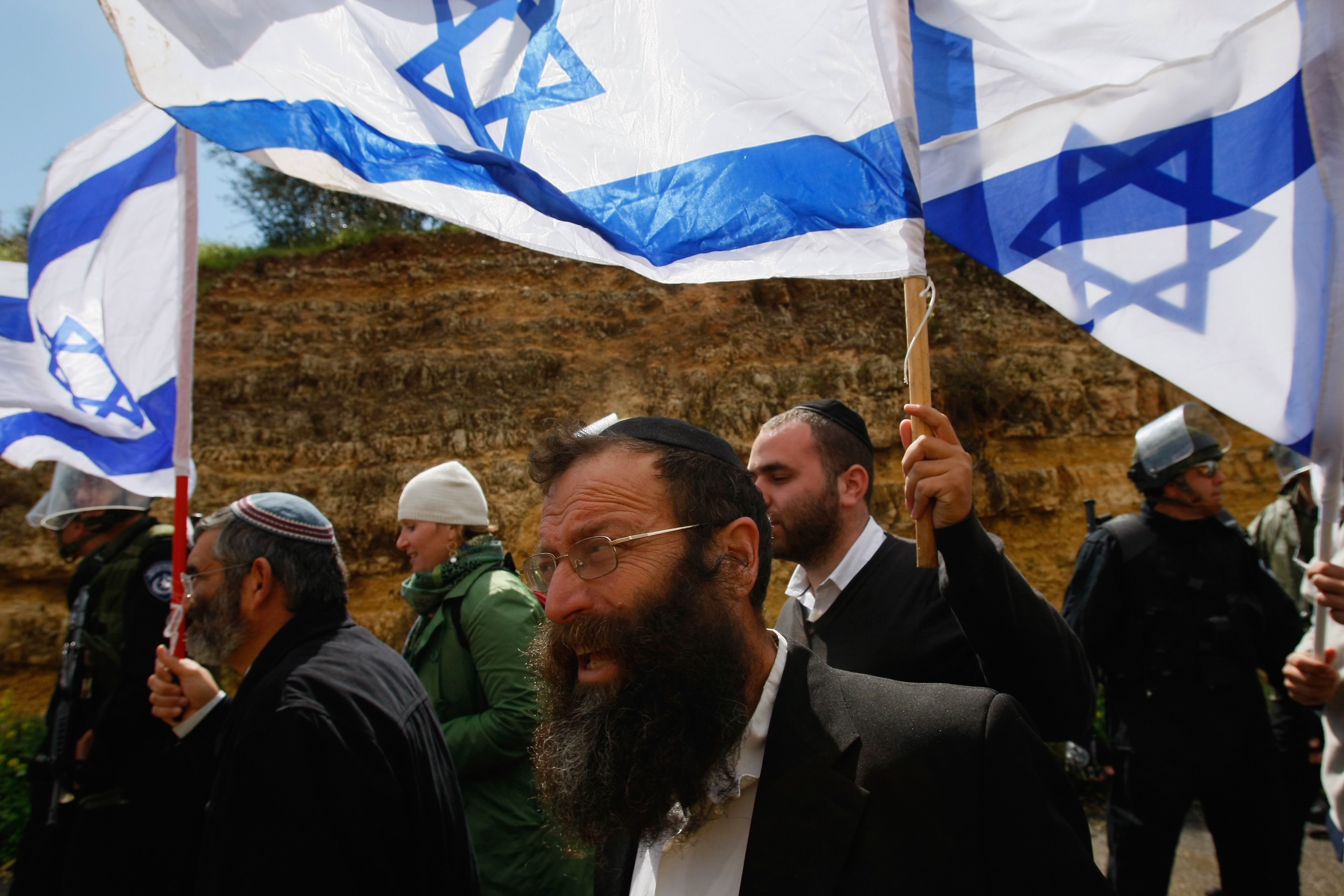 David Silverman/Getty Images. Right-wing Israeli extremist Baruch Marzel (C) leads a provocative march with flags March 24, 2009 in Umm al-Fahm in northern Israel. Violent clashes broke out between residents of Israel's largest Arab city during of the rally.