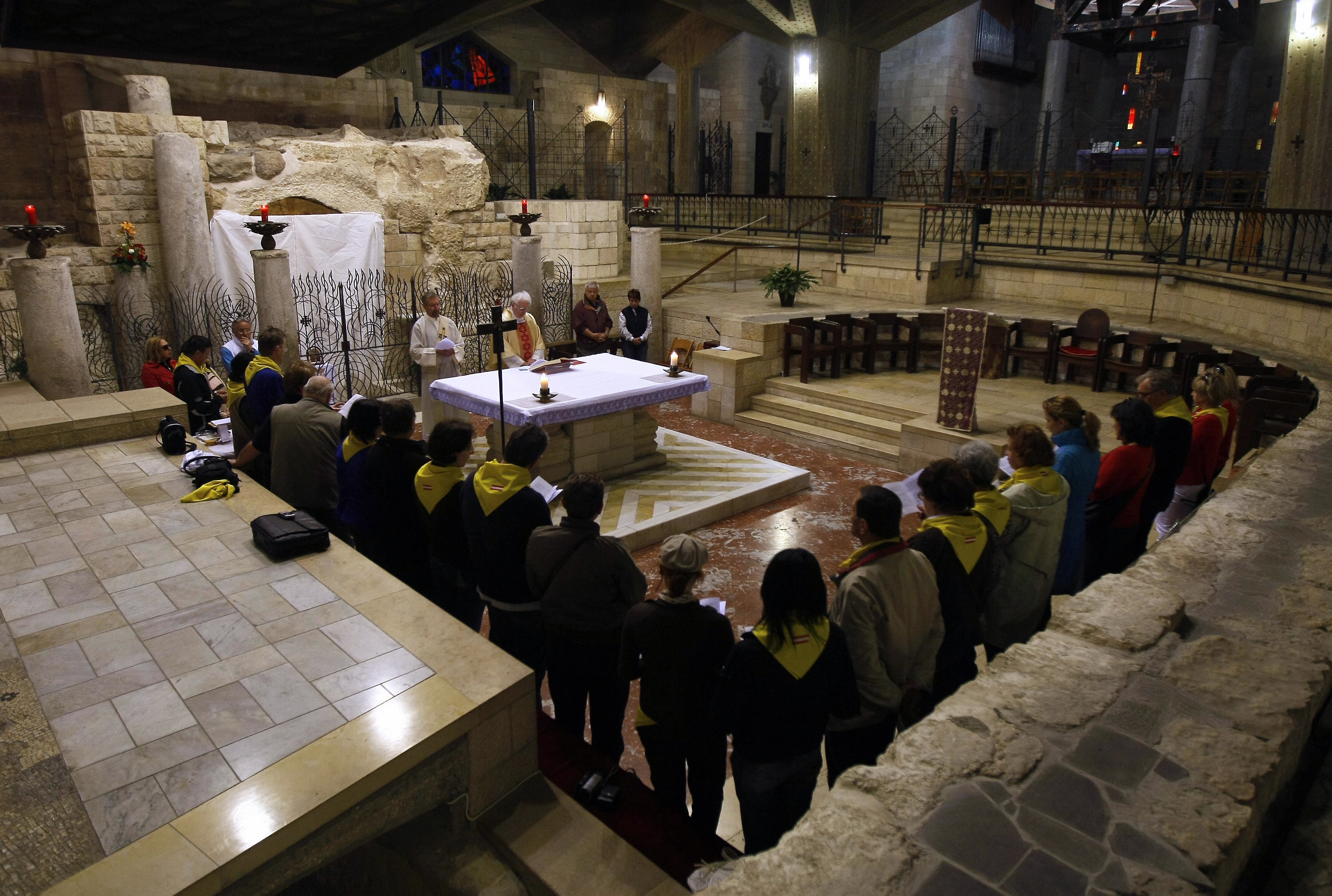 MENAHEM KAHANA/AFP/Getty Images. Christian pilgrims attend Sunday mass at the grotto of the Church of the Annunciation.