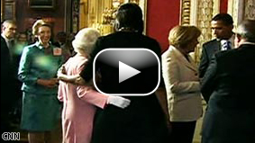 Britain's Queen Elizabeth II and first lady Michelle Obama embrace while meeting Wednesday in London.