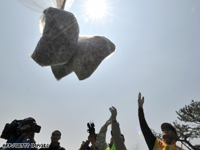 South Korean activists on Sunday launch a balloon carrying leaflets intended to land in North Korea.