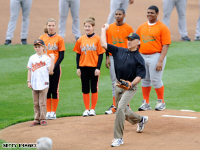 The vice president lobbed a high ball to catcher Chad Moeller to kick off the O's season.