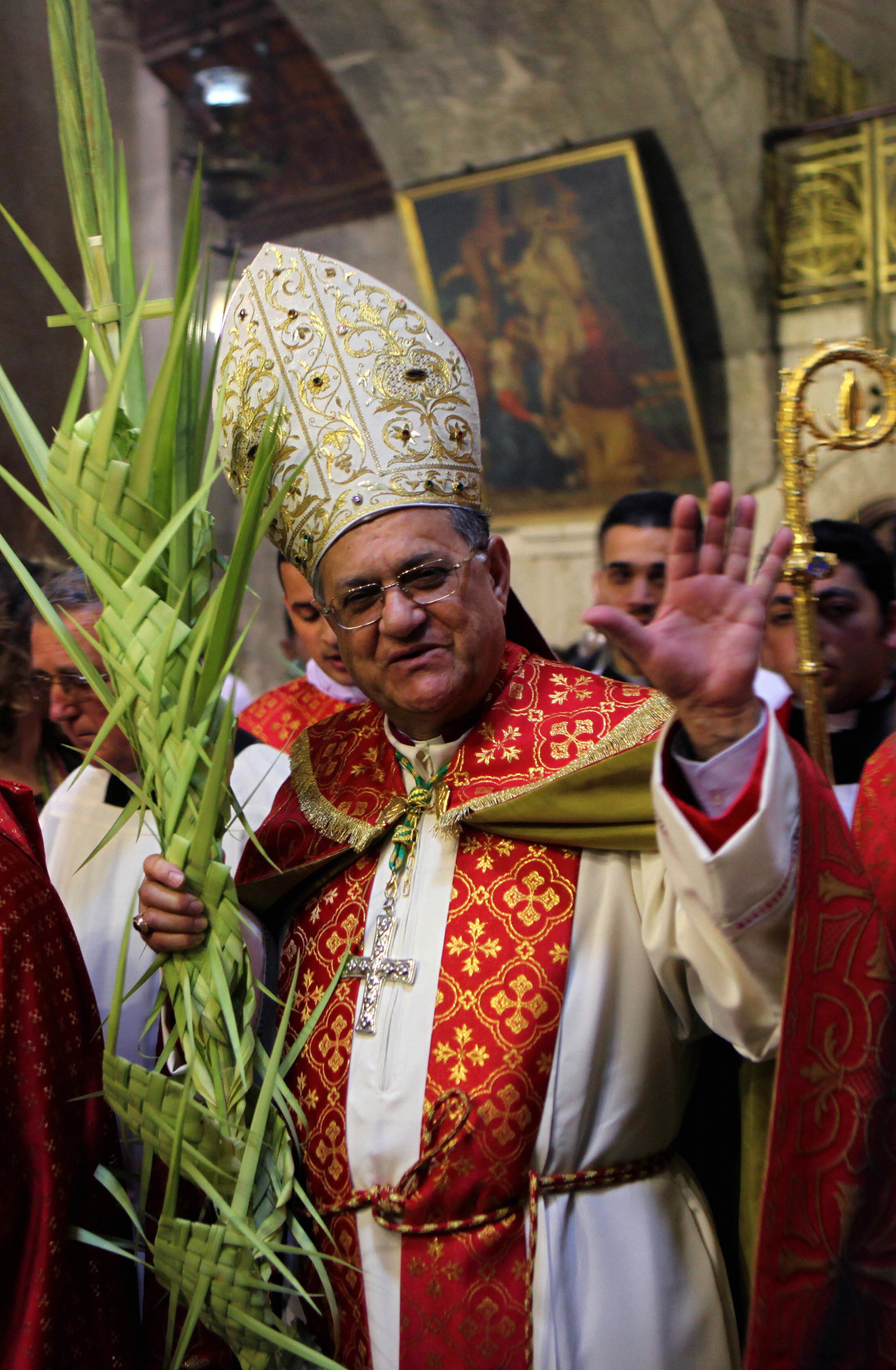 GALI TIBBON/AFP/Getty Images. The head of the Roman Catholic Church in the Holy Land, the Latin Patriarch of Jerusalem Fuad Twal, leads the Palm Sunday procession at the Church of the Holy Sepulchre in Jerusalem's Old City on April 05, 2009. The ceremony is a landmark in the Roman Catholic calendar, marking the triumphant return of Christ to Jerusalem the week before his death, when a cheering crowd greeted him waving palm leaves. Palm Sunday marks the start of the most solemn week in the Christian calendar.