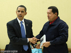Venezuelan President Hugo Chavez gives a book to President Obama April 18