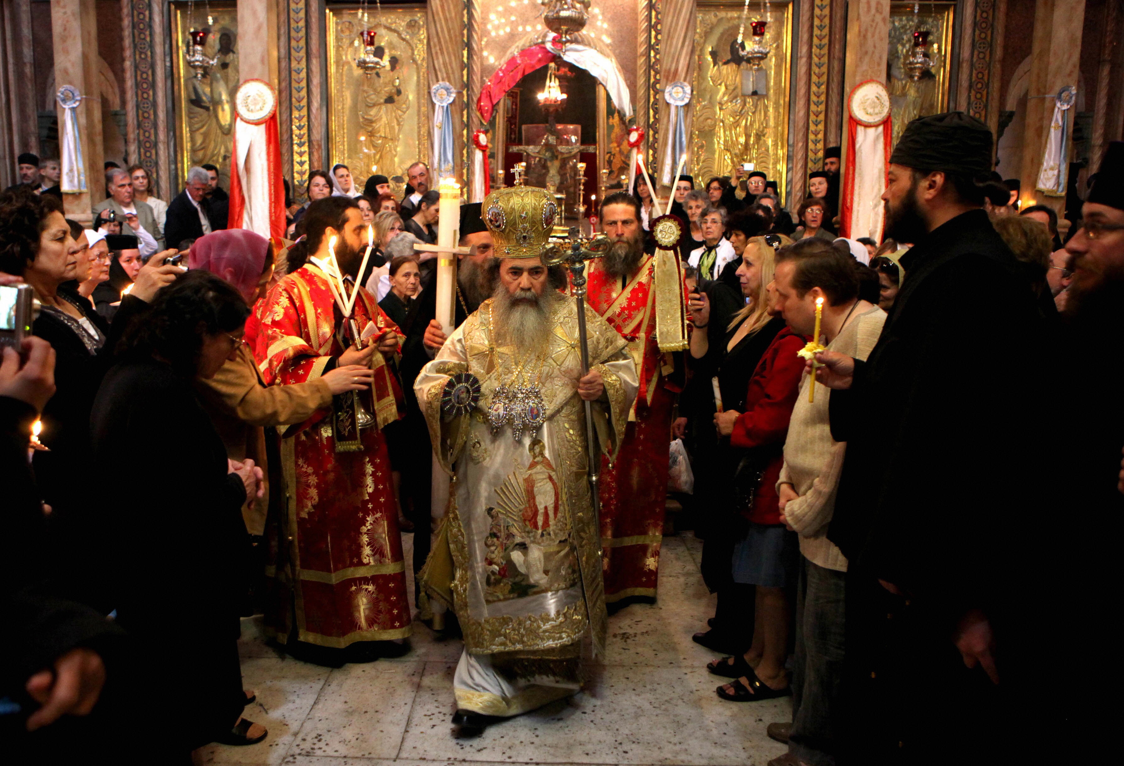 GALI TIBBON/AFP/Getty Images. Greek Orthodox Patriarch of Jerusalem Theophilos III leads the Easter Sunday mass at the Church of the Holy Sepulchre in Jerusalem's Old City on April 19, 2009, where according to Christian tradition Jesus Christ rose on the third day following his crucifixion. Easter celebrates the Resurrection of Christ after his crucifixion on Good Friday.