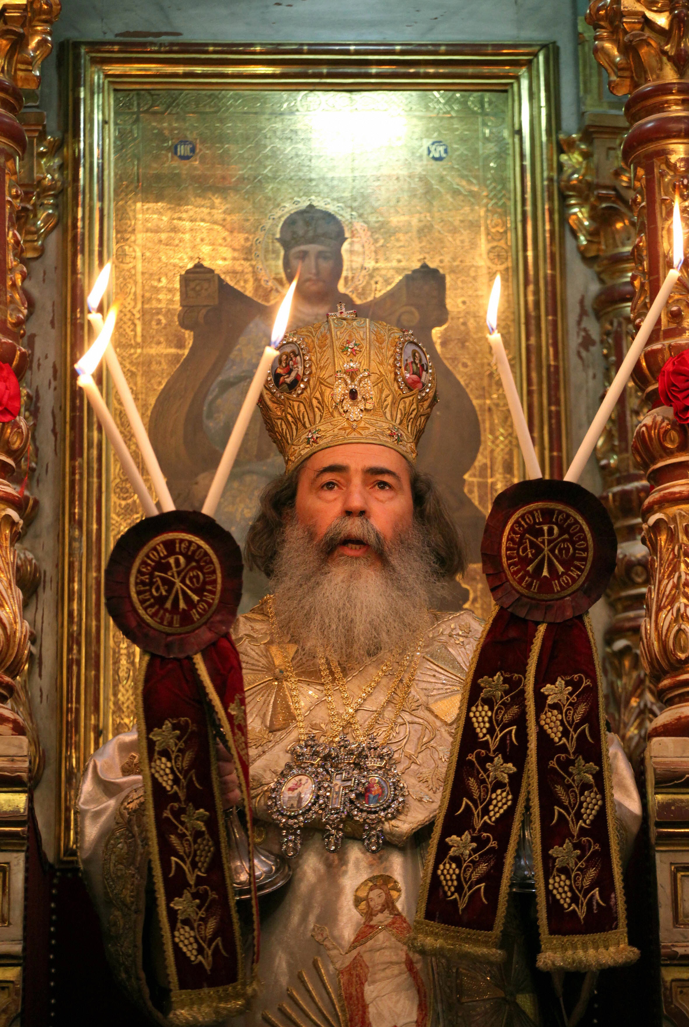 GALI TIBBON/AFP/Getty Images. Greek Orthodox Patriarch of Jerusalem Theophilos III leads the Easter Sunday mass at the Church of the Holy Sepulchre in Jerusalem's Old City on April 19, 2009.