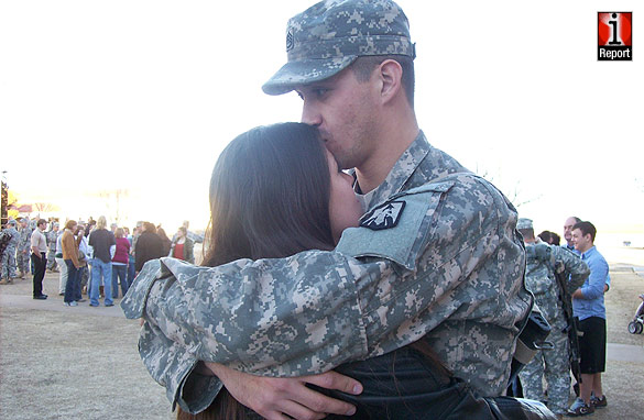Sgt Thorman kisses his wife Kimberly.