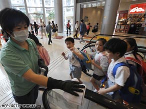 A government cleaner takes part in a precautionary clean up in Hong Kong on April 30.