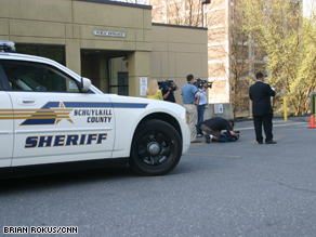 A police car outside an entrance to the courthouse on the first day of the trial.