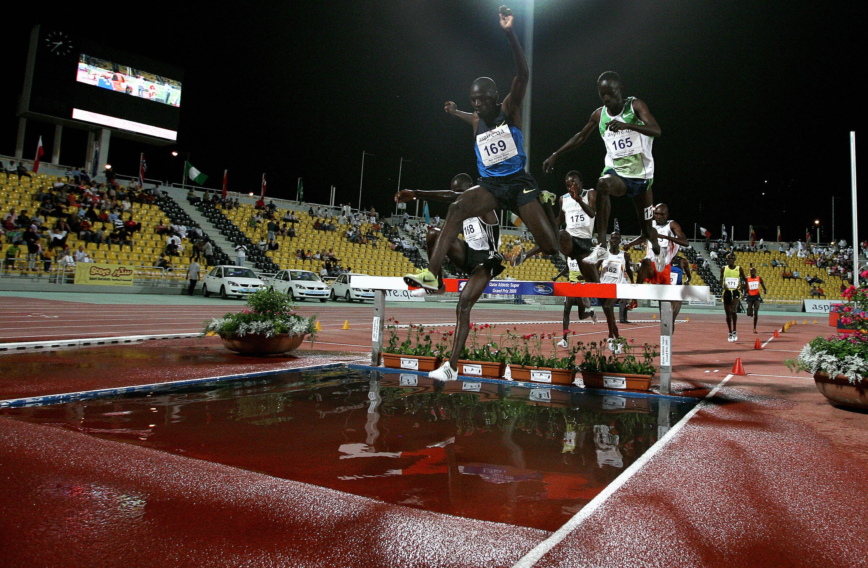 MARWAN NAAMANI/AFP/Getty Images.Kenya's Ezekiel Kemboi (R) and Paul Kipsiele Koech jump over a pool of water during the men's 3000m steeplechase race at the Qatar Super Grand Prix in Doha late on May 8, 2009. Kemboi clinched the first place while Koech came in second.