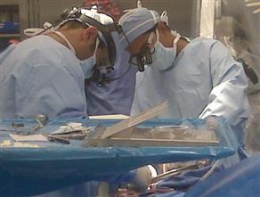 Dr. Sanjay Gupta (right) at work in the O.R.
