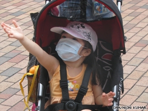 With her preschool classes cancelled, Mandy Yuen's daughter enjoys a day at Disneyland.