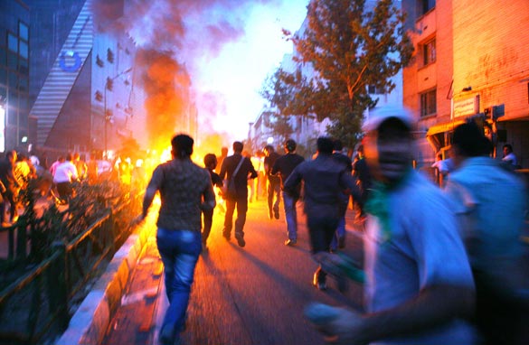Supporters of defeated Iranian presidential candidate Mir Hossein Mousavi run in the streets during protests June 16, 2009 in Tehran, Iran. Getty Images