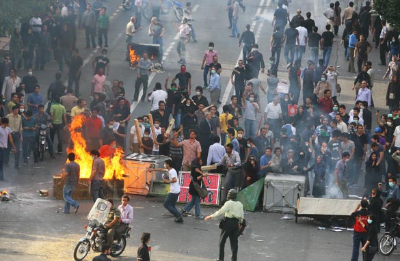Supporters of Iran's defeated presidential candidate Mir Hossein Mousavi set burning barricades in the streets as they protest during a demonstration on June 20, 2009 in Tehran, Iran. Getty Images