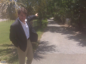 David Mattingly stands at the end of the driveway to Gov. Sanford's beach house.