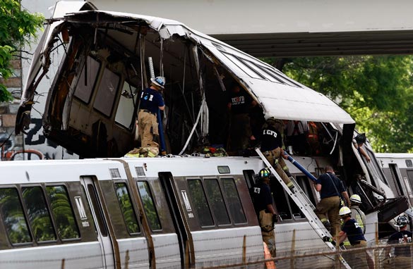 Rescue workers respond to the site of two Red Line Metrorail trains that collided with one another between the Fort Totten and Takoma Park stations during the evening rush hour June 22, 2009 in Washington, DC.