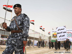 Iraqi soldiers join in a parade Tuesday in Karbala to mark the withdrawal of U.S. troops from cities and towns.