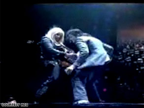 Michael Jackson rocking out with Orianthi during a rehearsal for his London comeback .