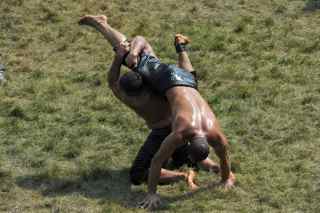 MUSTAFA OZER/AFP/Getty Images. Turkish oil wrestlers fight during the 648th historical Kirkpinar oilwrestling tournament held every year in Sarayici, near Edirne, on July 5, 2009.