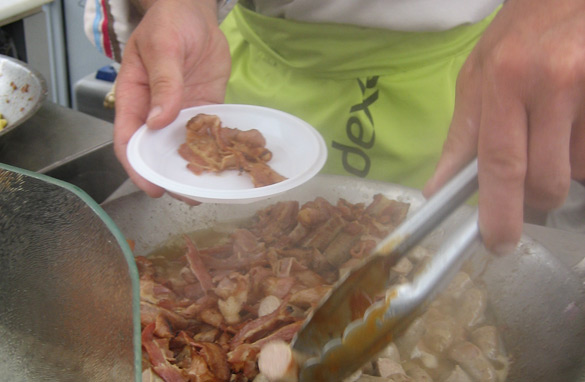 A mini-breakfast of bacon and sausage, just one of the many free food options in the Tour de France village.