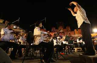 LOUAI BESHARA/AFP/Getty Images. British conductor Howard Williams leads the Syrian children's orchestra at the old Damascus Fair Theatre.
